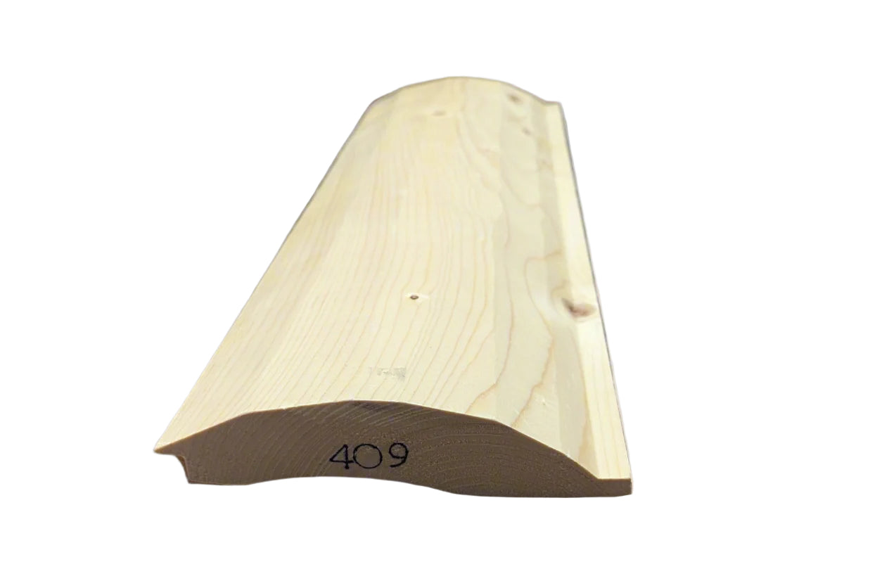 A piece of milled quarter log siding with a shiplap profile, peeled, showing the natural wood texture and the number 409 marked on it.